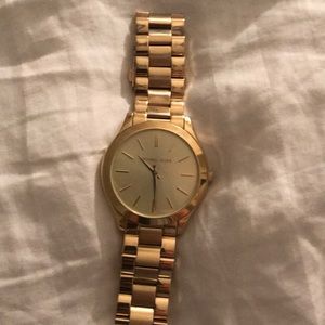 Michael Kors gold watch.